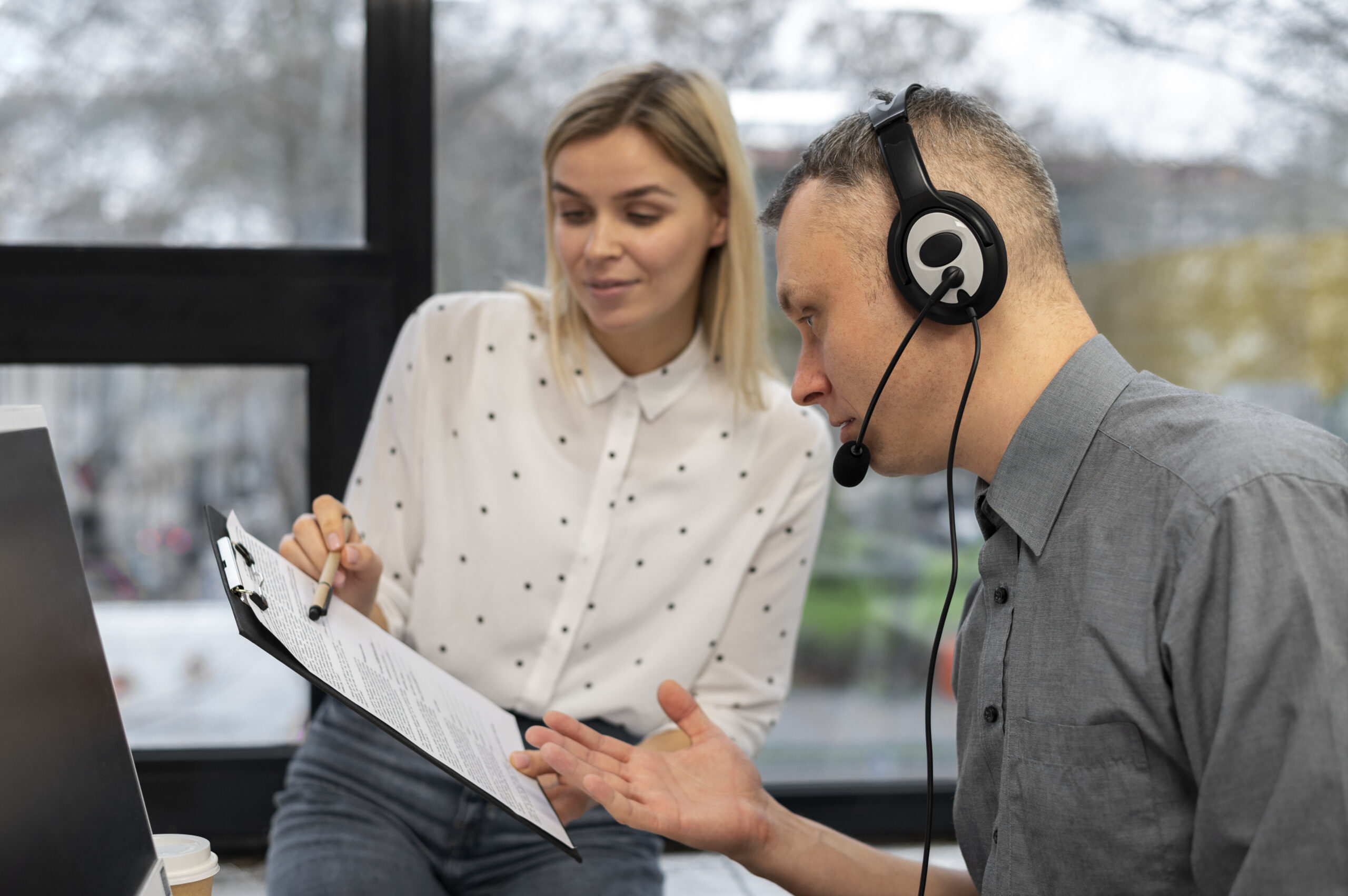 Experienced call center agents collaborating on complex workflows